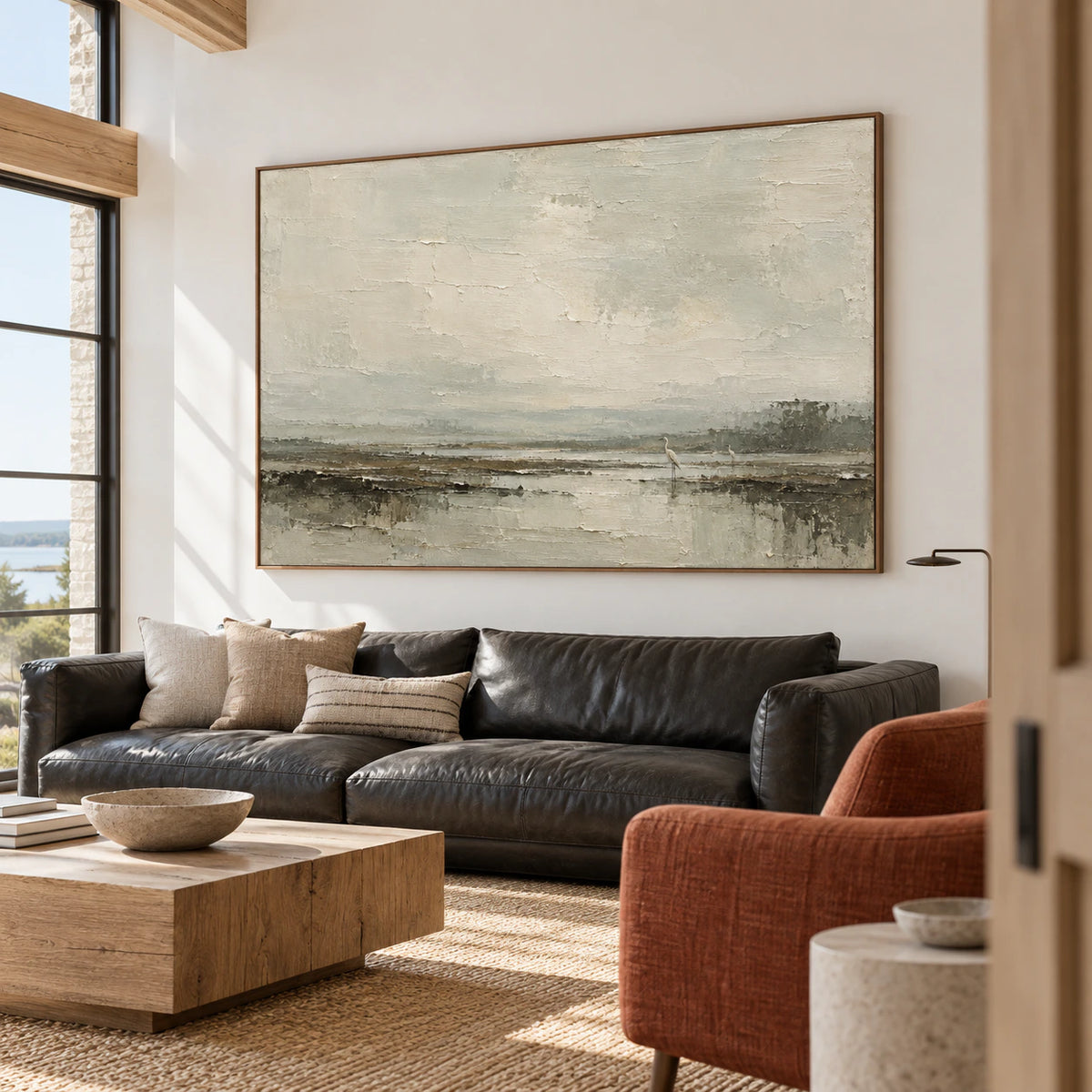 Large marsh artwork in an expansive loft interior, with its weathered pale sky, reflective marsh, and two birds unmistakably visible.