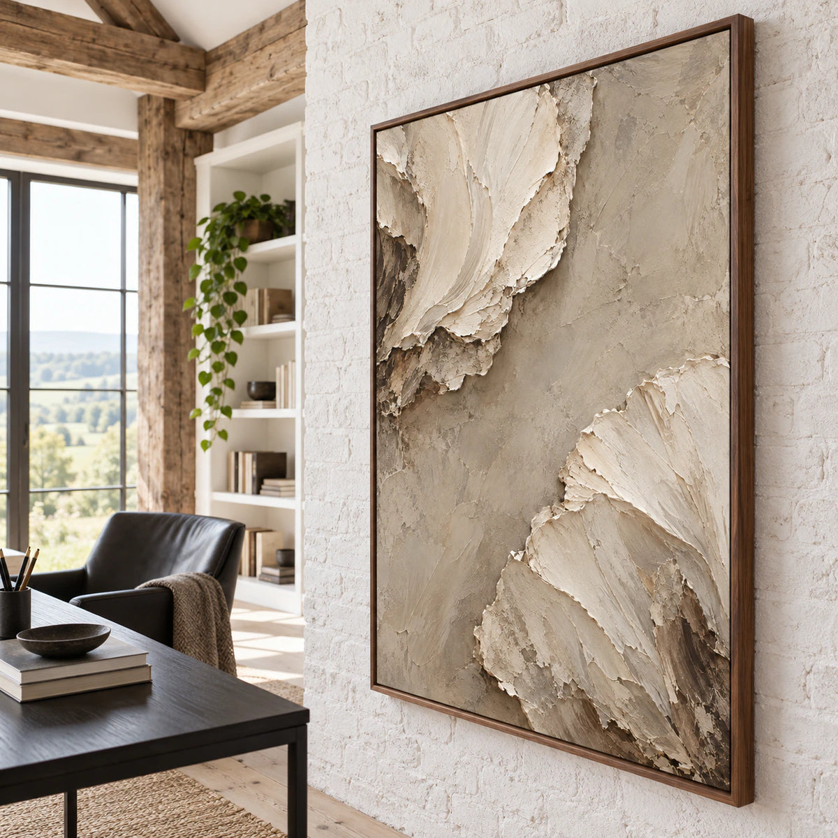 Large textured neutral painting in an airy daylight reading and home-office space.