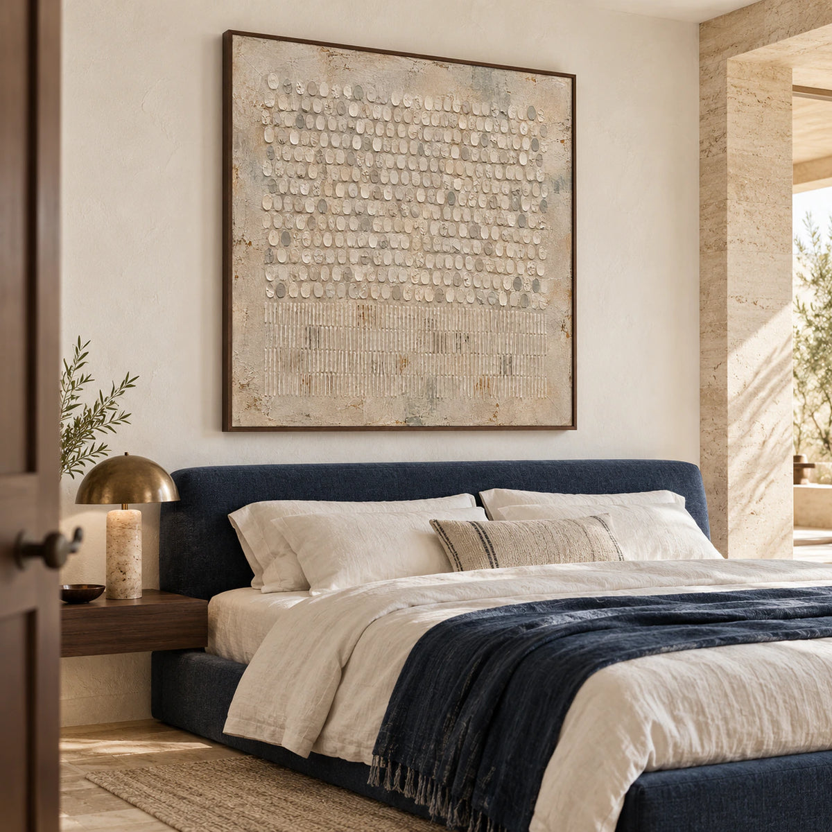 Square textured abstract painting above a low bed in a quiet, light-filled bedroom.