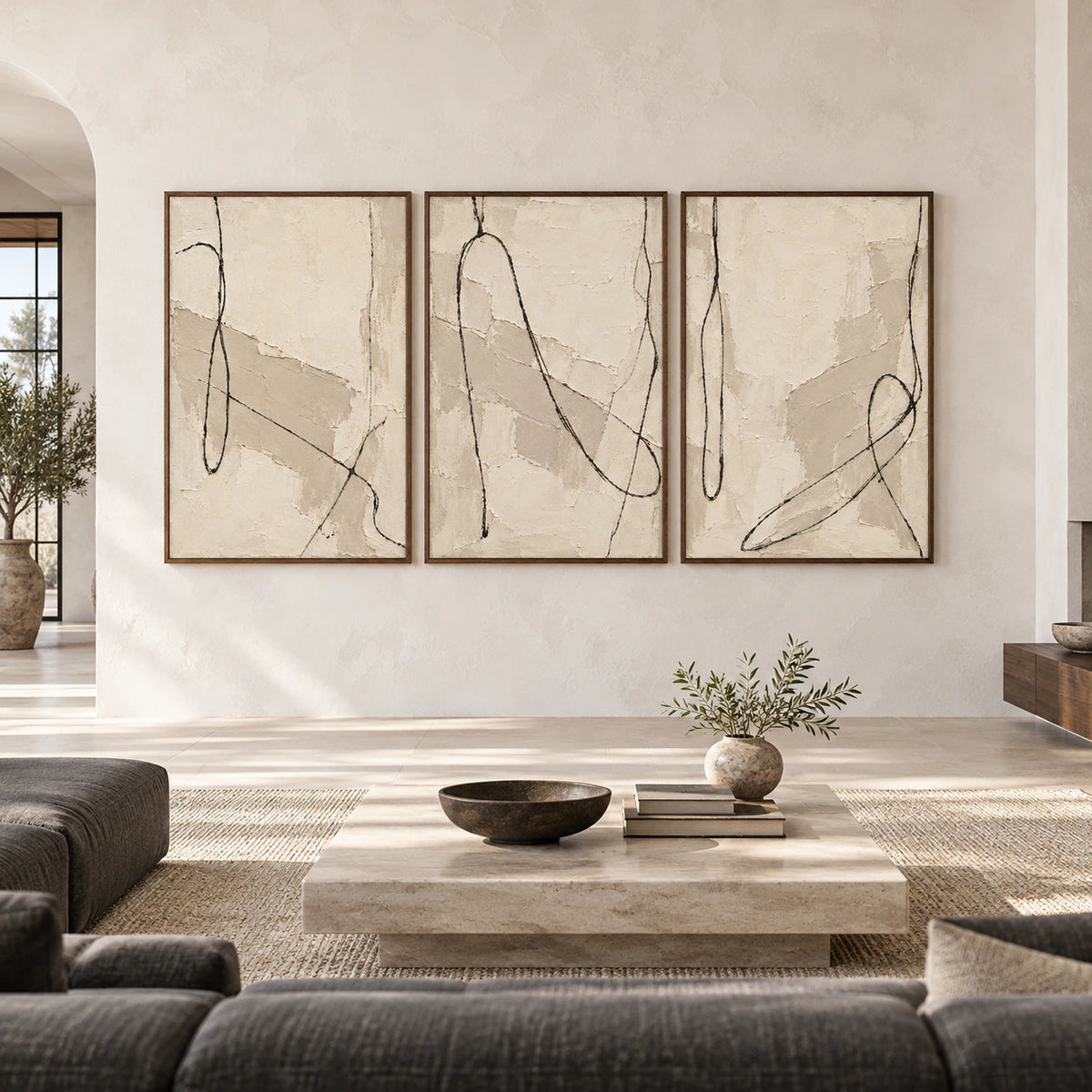 Large straight-on gallery view of the Tactile-Script ivory and taupe triptych in slim walnut frames.