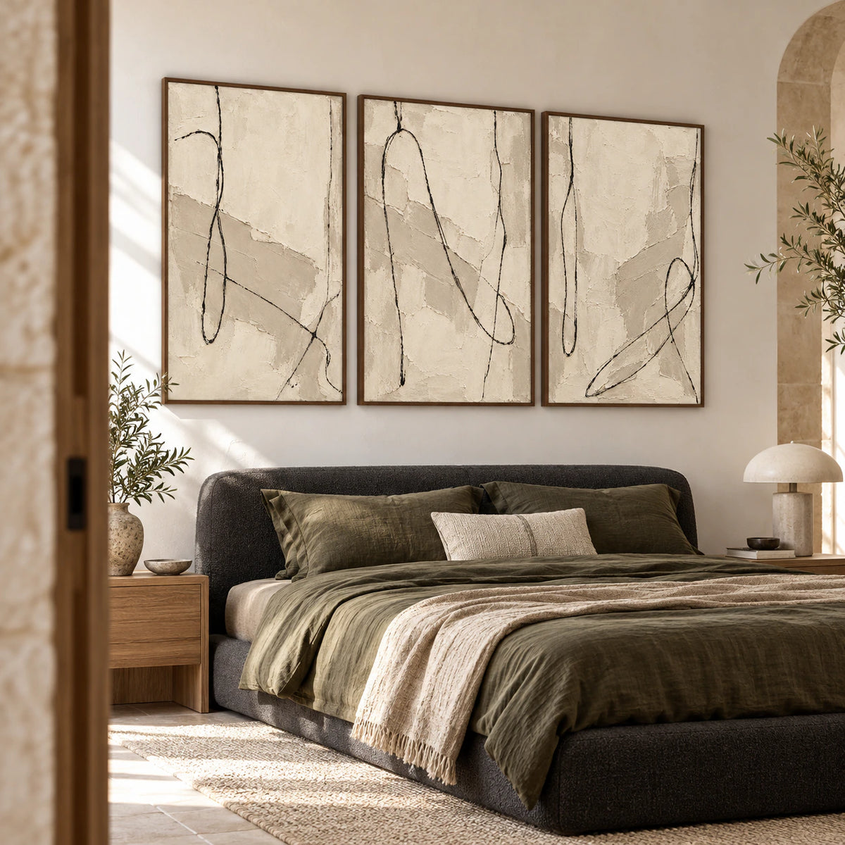 Tactile-Script triptych above a low bed in a quiet, sunlit bedroom.