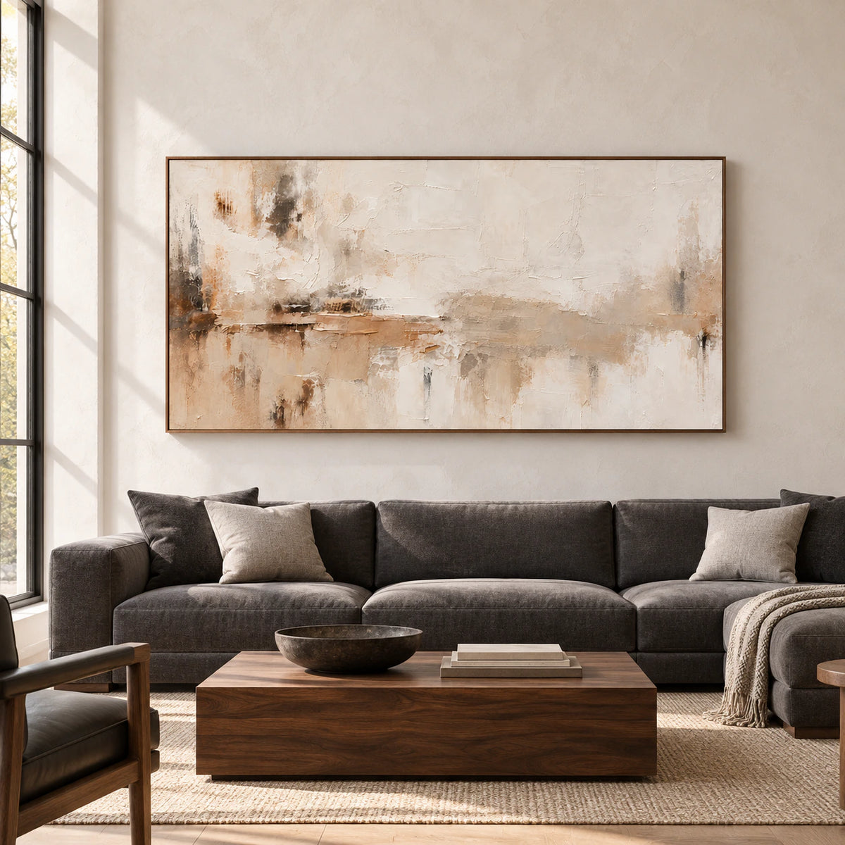 Tawny-Palimpsest on a broad pale plaster wall in a bright living room with charcoal furniture and wood accents, viewed straight on.