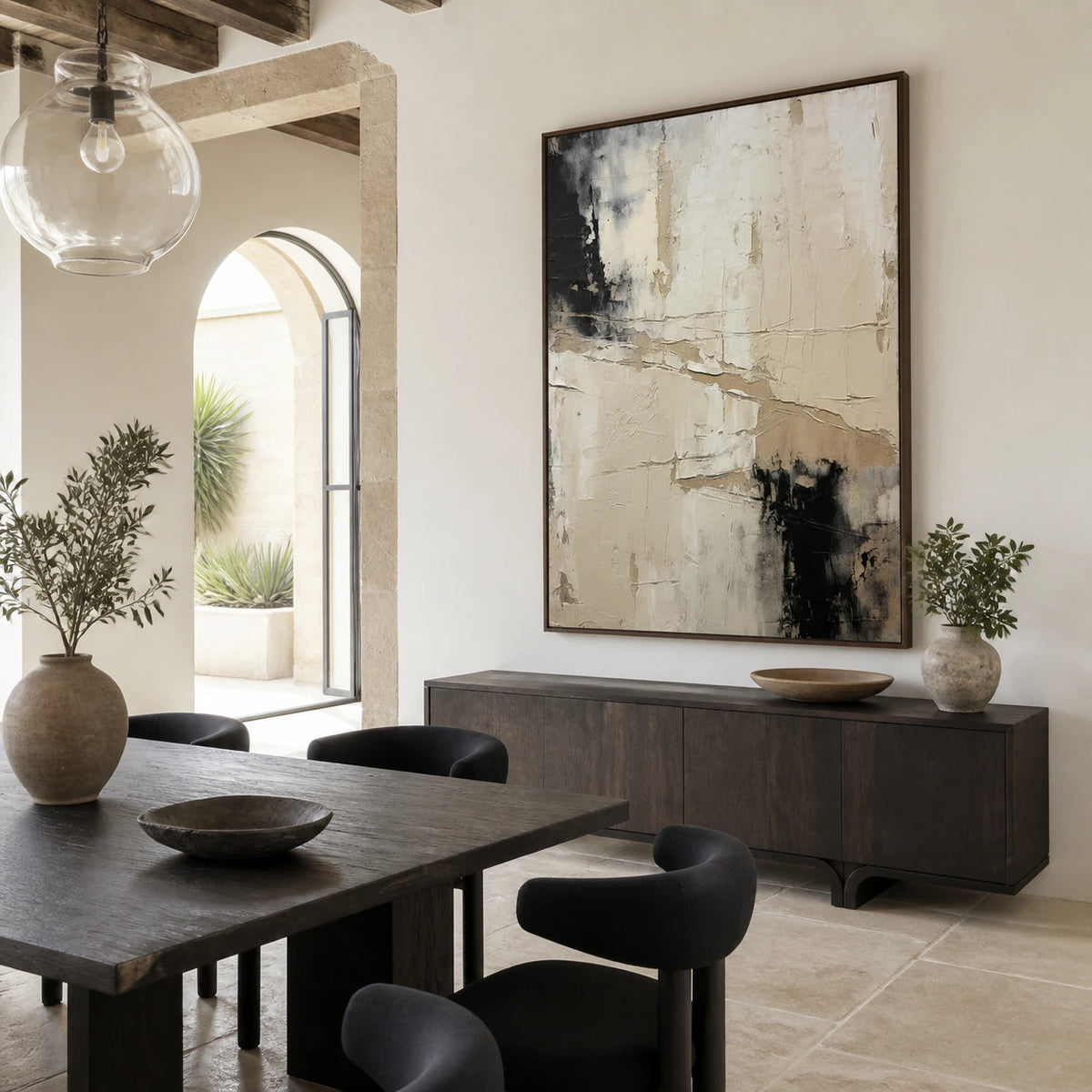 Refined dining room centered on the layered ivory and charcoal abstract painting.