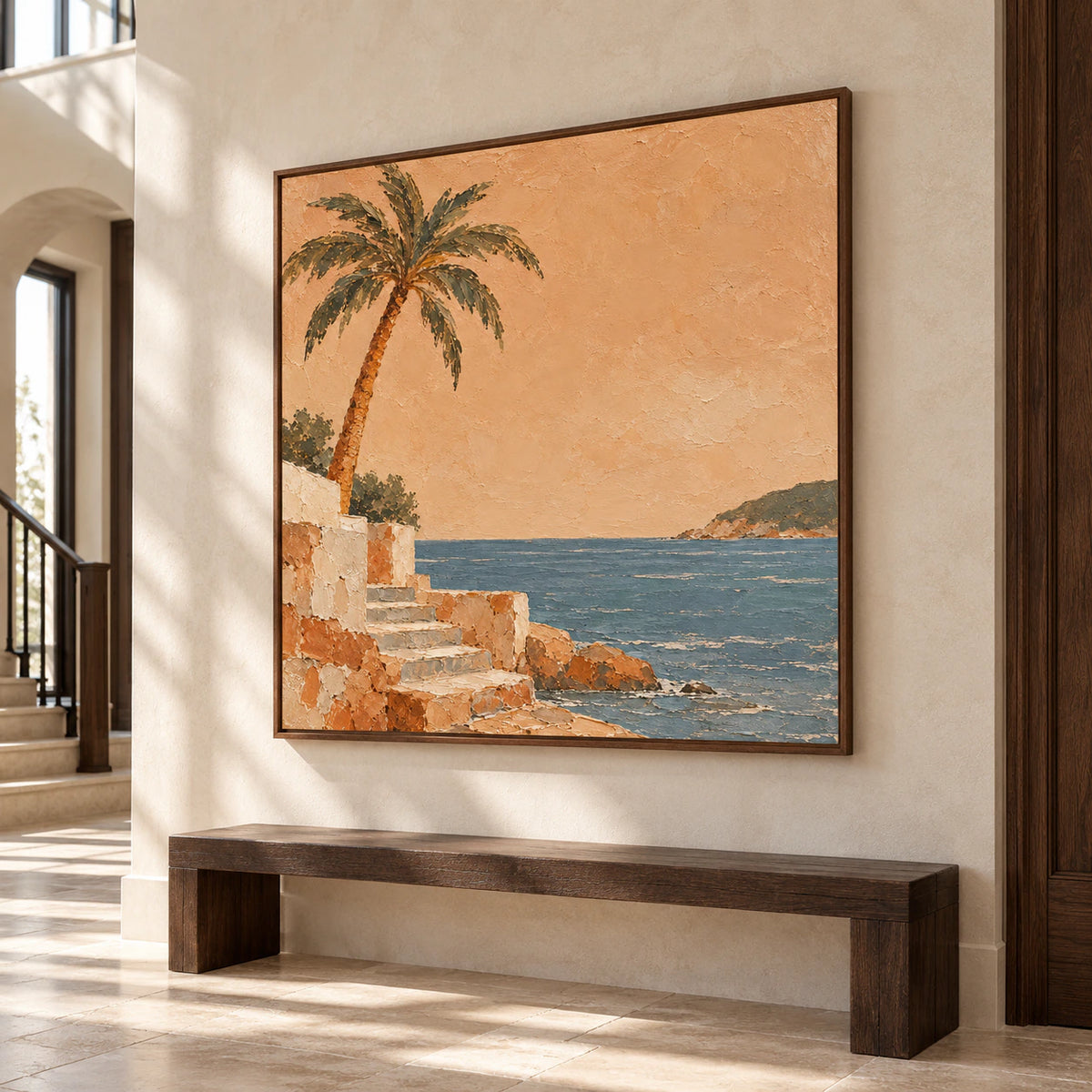 Large square coastal artwork commanding a bright gallery-scale foyer with limestone flooring and a simple bench.