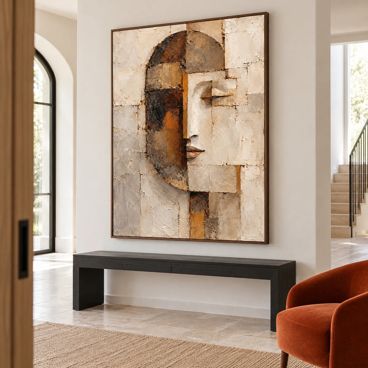 Large textured portrait commanding a bright, spacious foyer with a sculptural console.