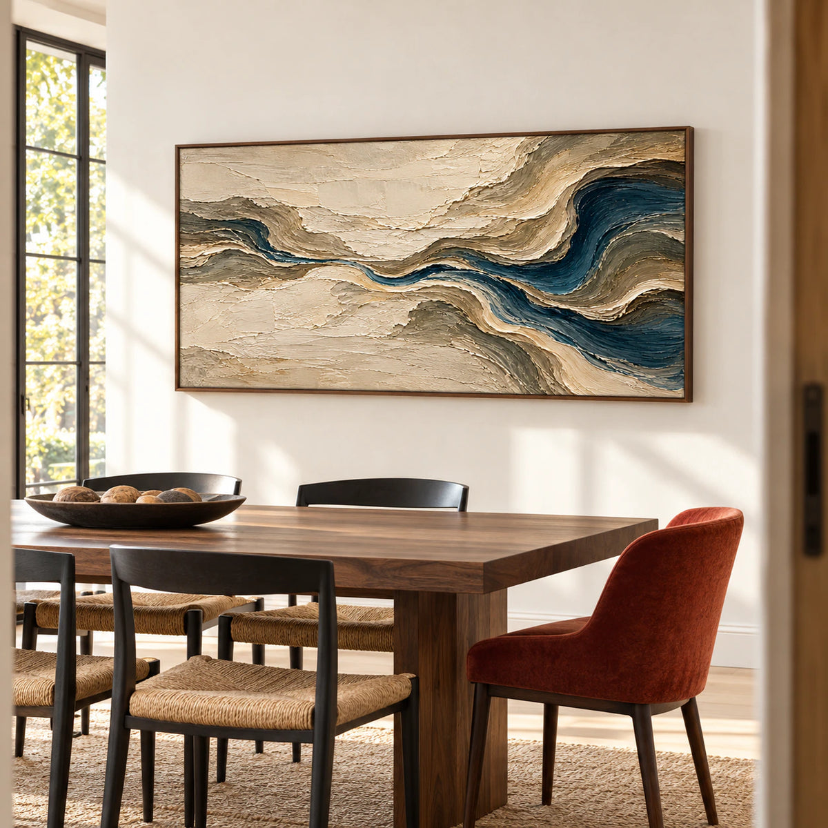 Tidal-Gesso on a warm white dining room wall above a dark walnut table and black chairs, viewed obliquely from the right in daylight.