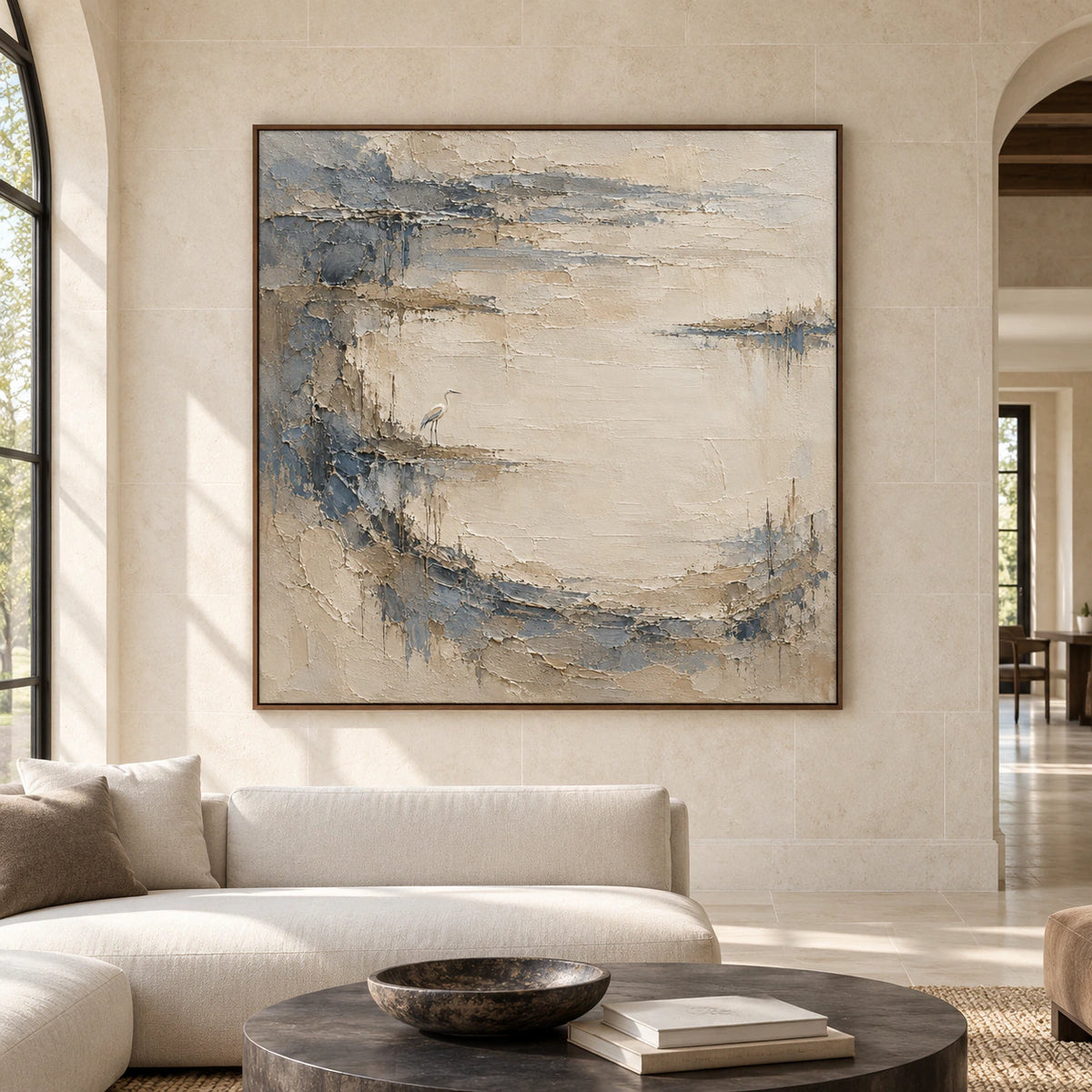 Large square Tidal Heron artwork centered on a pale architectural wall in a spacious room, viewed straight on.
