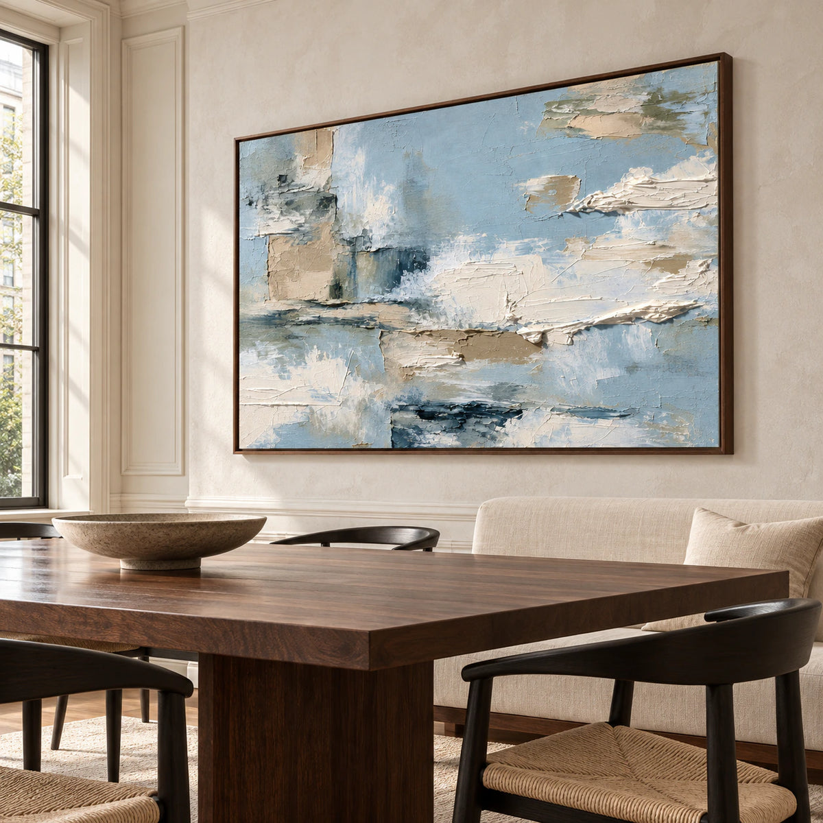Tidal-Mantle in a sunlit dining room with a dark walnut table, sculptural black chairs and a light stone wall, viewed from a slight right angle.