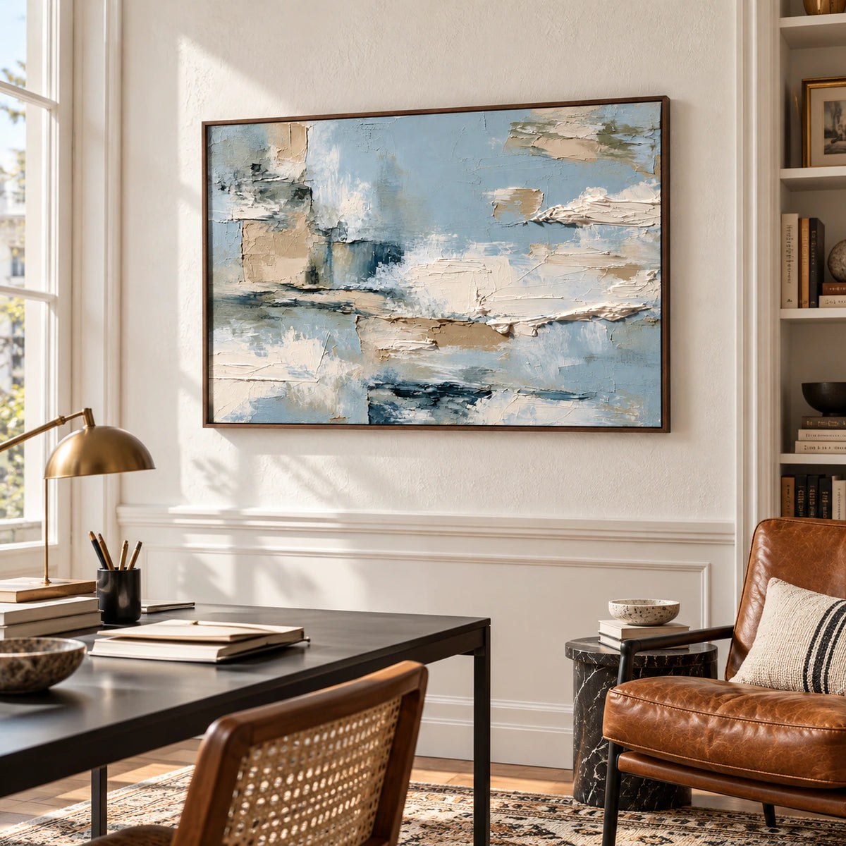Tidal-Mantle in an airy home office with a slim black desk, cognac leather reading chair and textured off-white wall, viewed from the right.