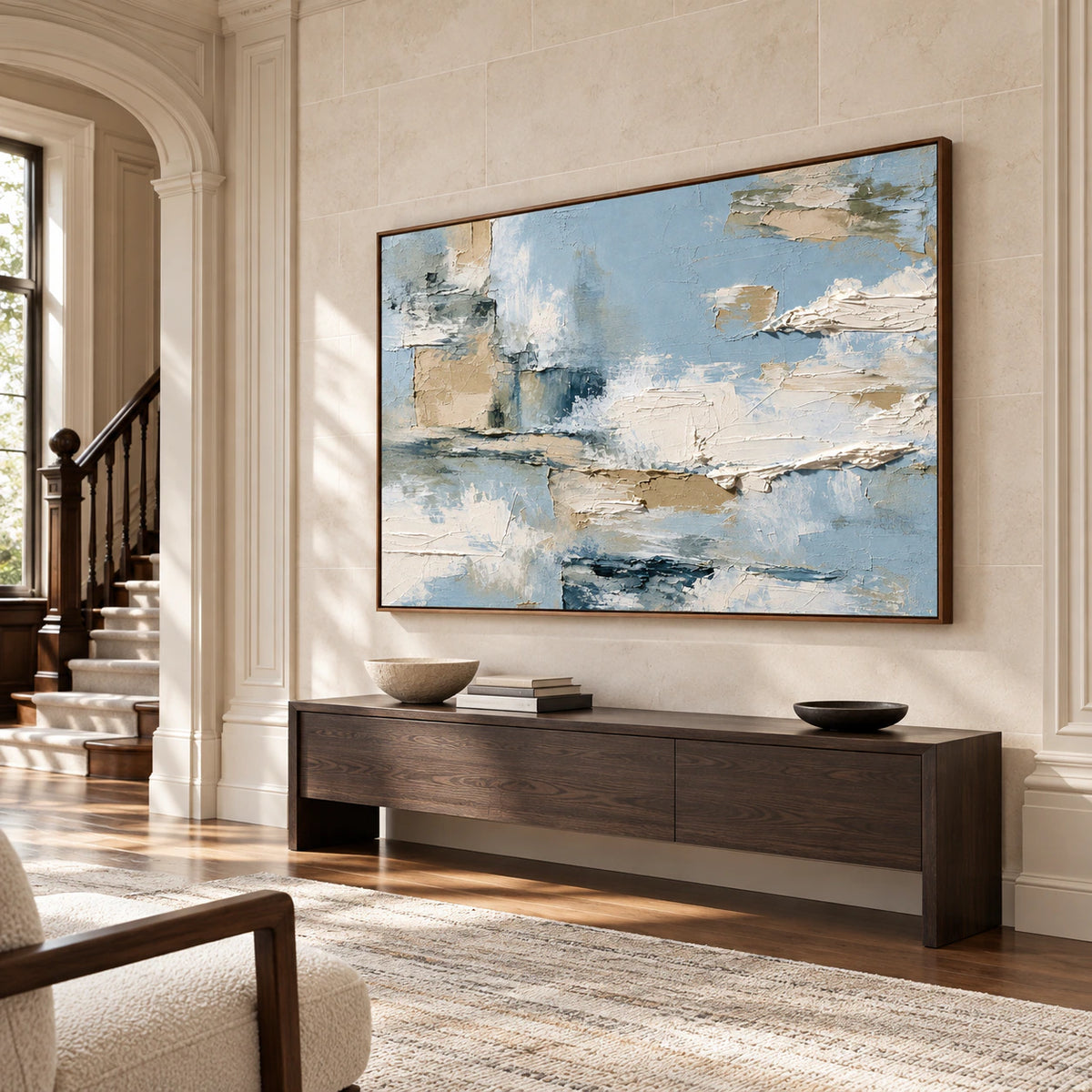 Tidal-Mantle on a tall pale limestone wall in a bright foyer with a dark console and open floor space, viewed from a low right angle.