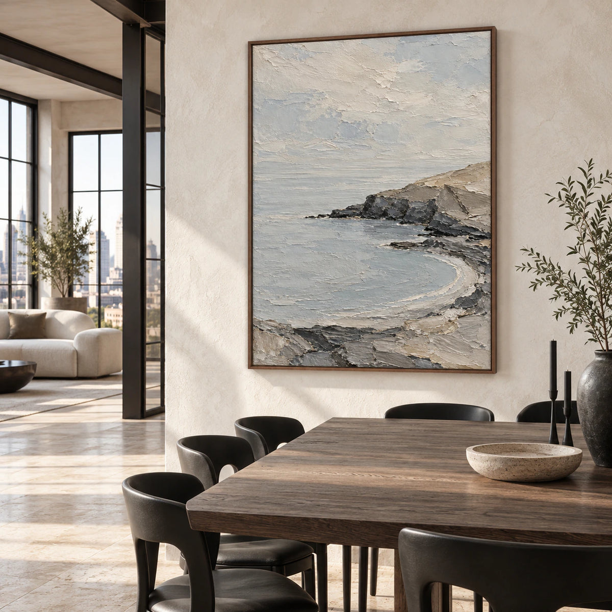 Textured coastal landscape as the focal point of a refined daylight dining room.