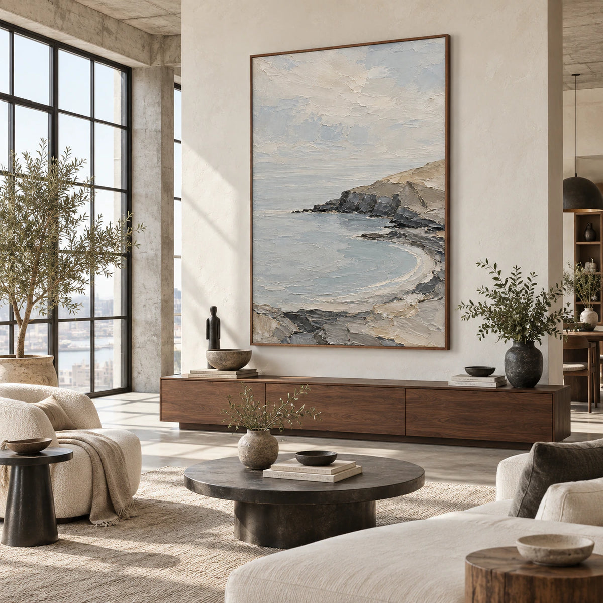 Textured coastal landscape displayed at scale in an open hospitality loft interior.