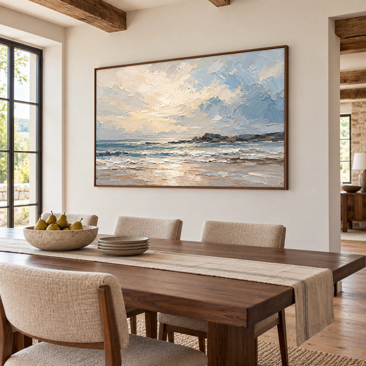 Seascape painting hanging above dining chairs on a light wall, viewed from a higher right angle across a long dark walnut dining table.