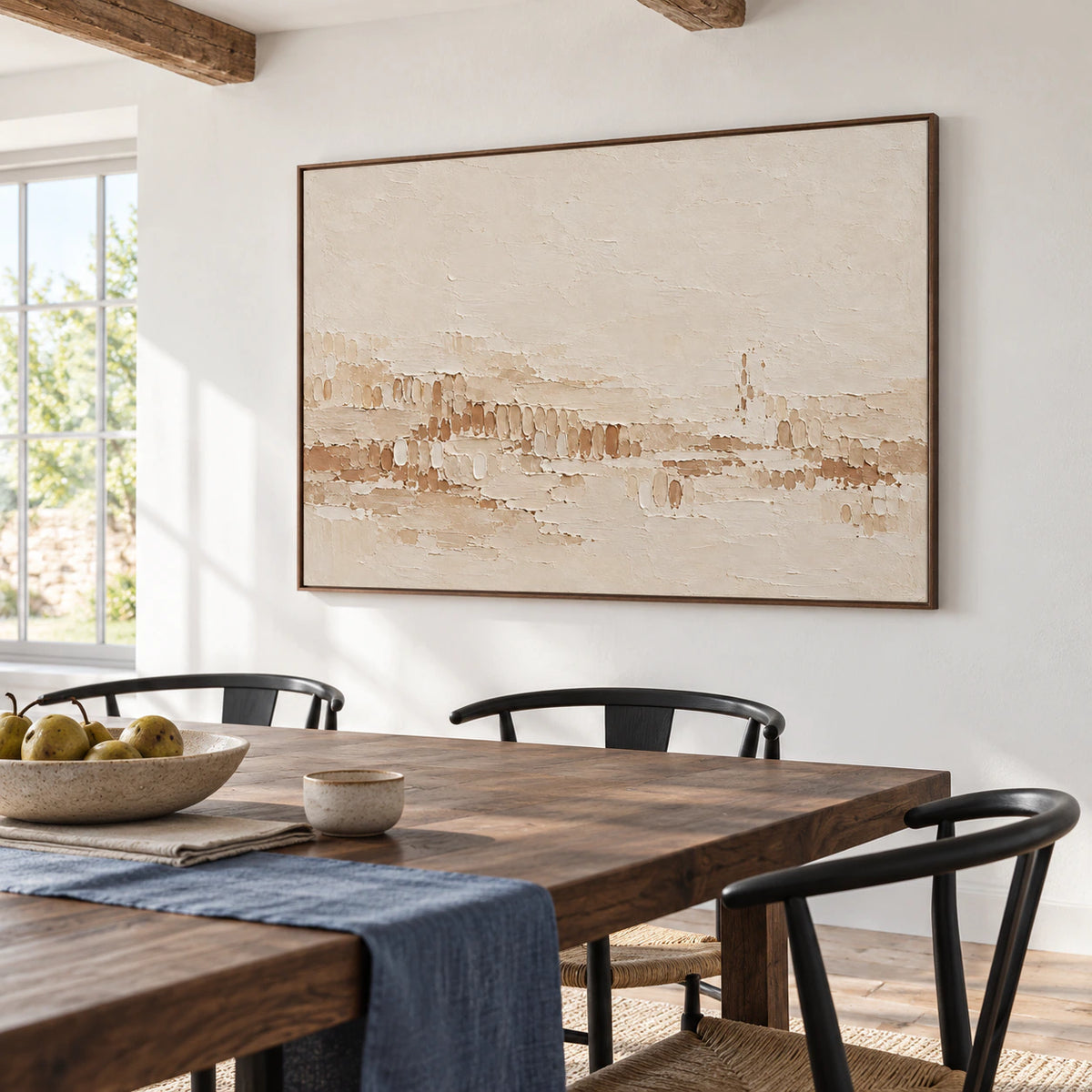 Tonal-Stitch artwork as the focal point of a refined dining room with a dark wood table and light plaster walls.