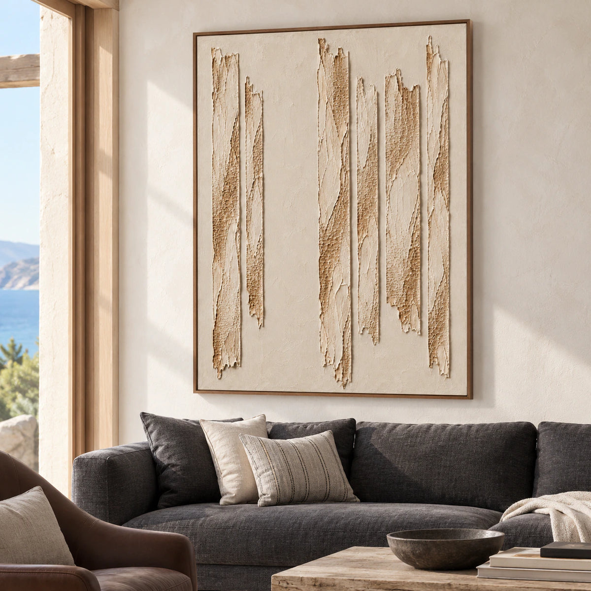 Left-oblique view of Torn-Cadence above a charcoal sofa against pale limewash walls in a bright living room.