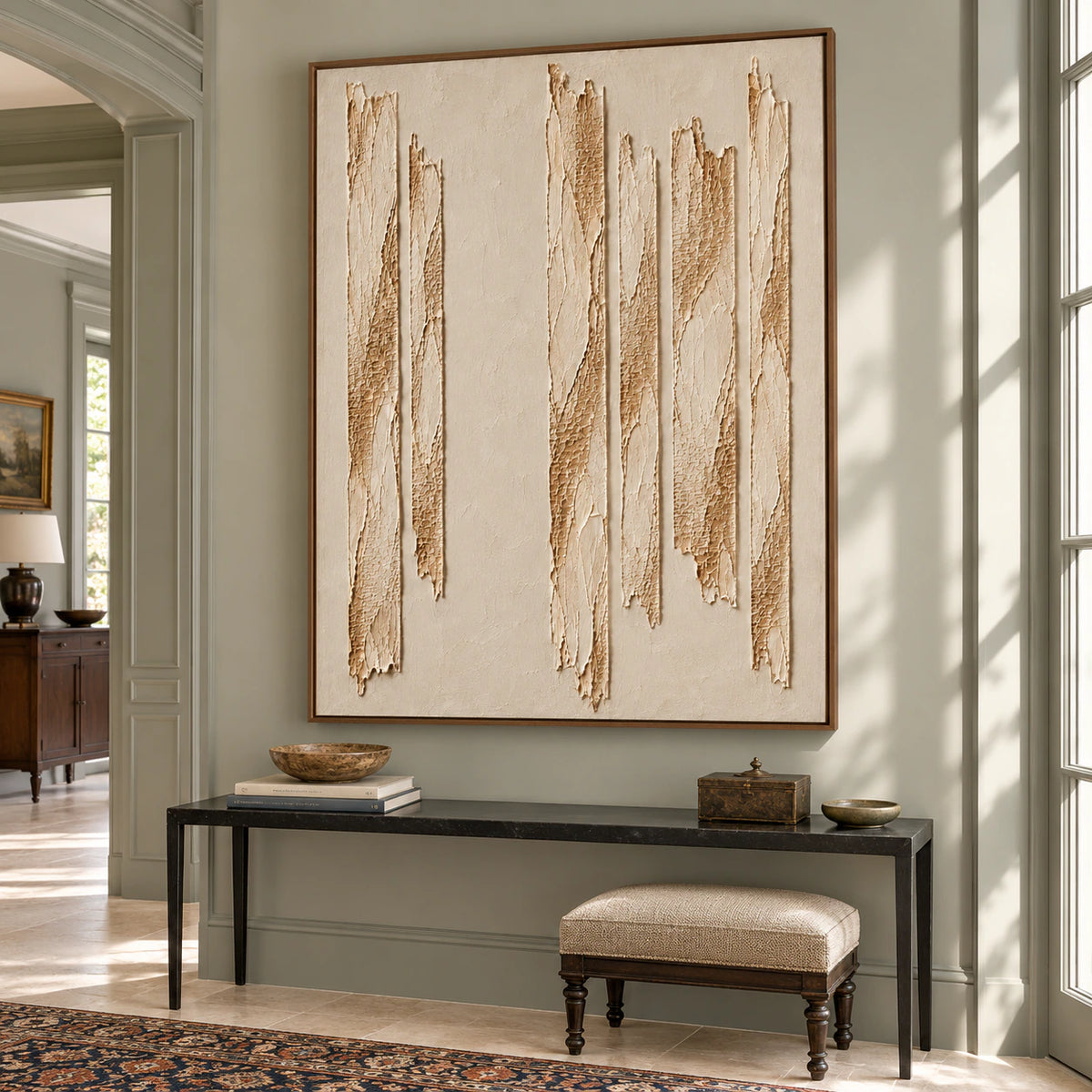 Right-oblique view of Torn-Cadence above a slim black console in a tall foyer with pale stone flooring and side-window daylight.