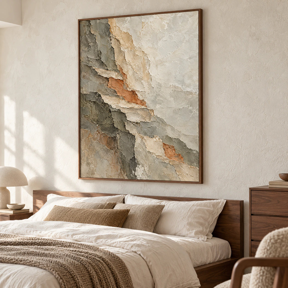 Large vertical abstract painting above a low walnut bed with soft white linen, viewed from the left slightly above bed height in a bright bedroom.