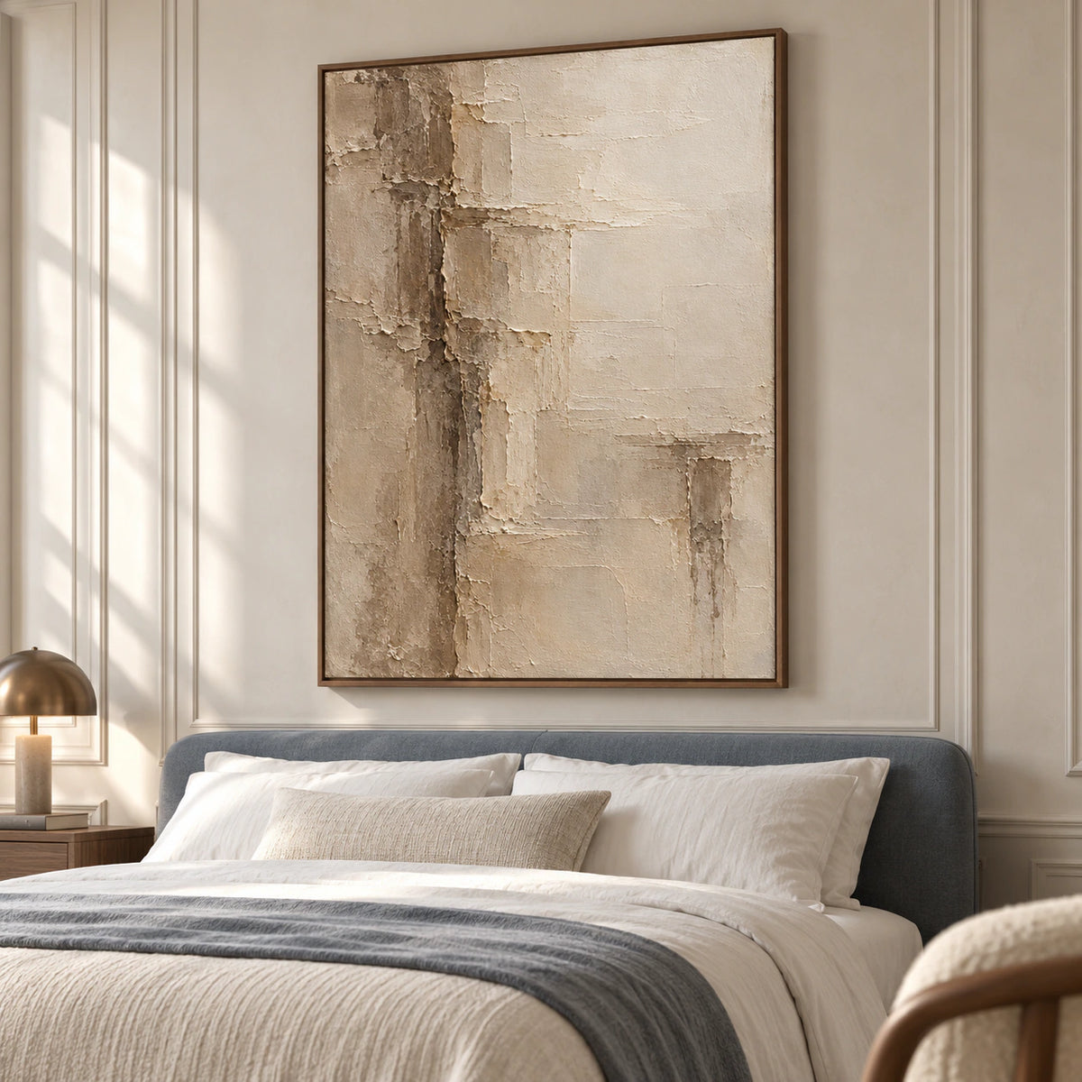 Torn-Meridian above a low bed with white linen and a blue-gray headboard against a pale stone wall, viewed from the left in soft daylight.