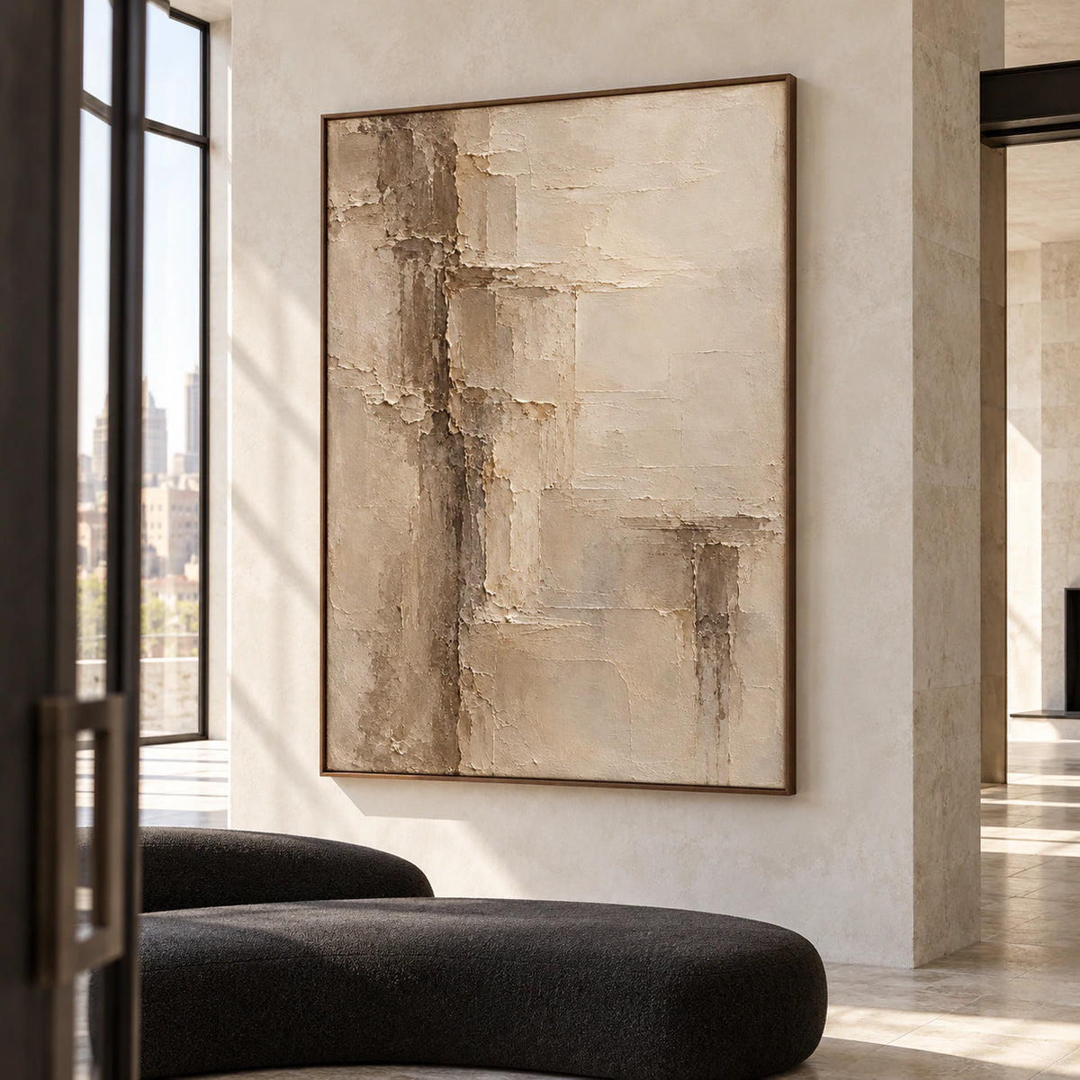 Torn-Meridian in a tall foyer with pale limestone architecture, a dark sculptural bench and daylight from a high window, viewed from the left.
