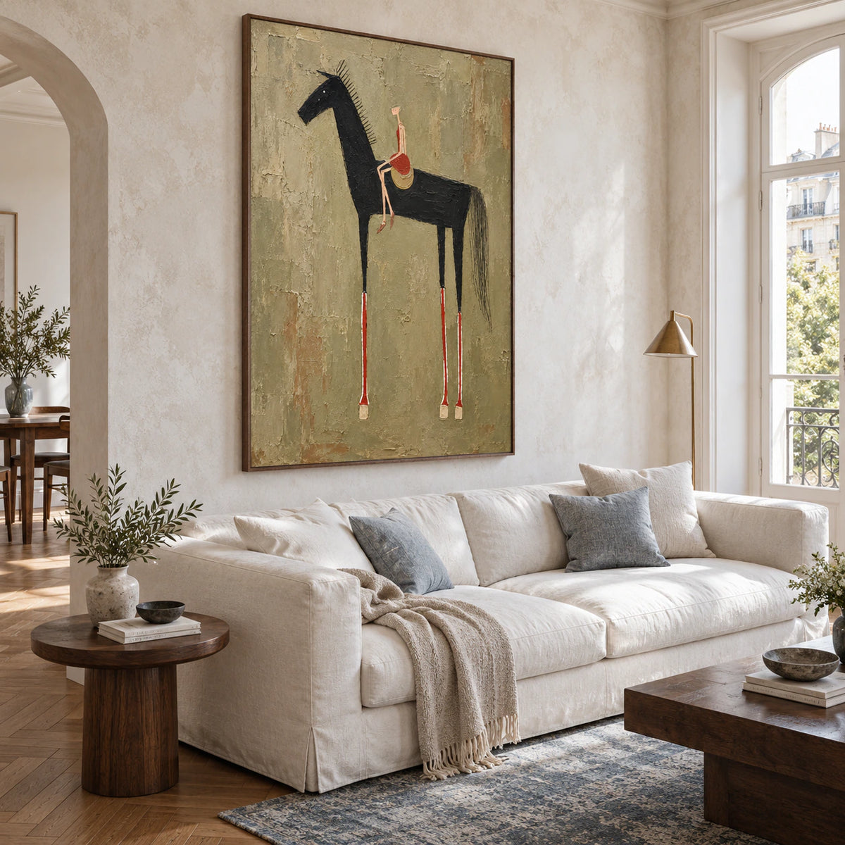 Umber-Canter as the focal artwork above a restrained sofa in a bright living room.