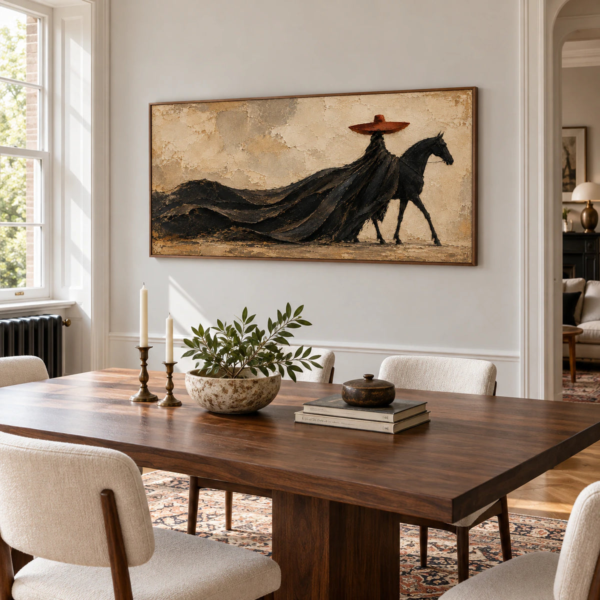 Horse and rider painting on a cool pale wall above a dark walnut dining table with light upholstered chairs, viewed from the right in daylight.