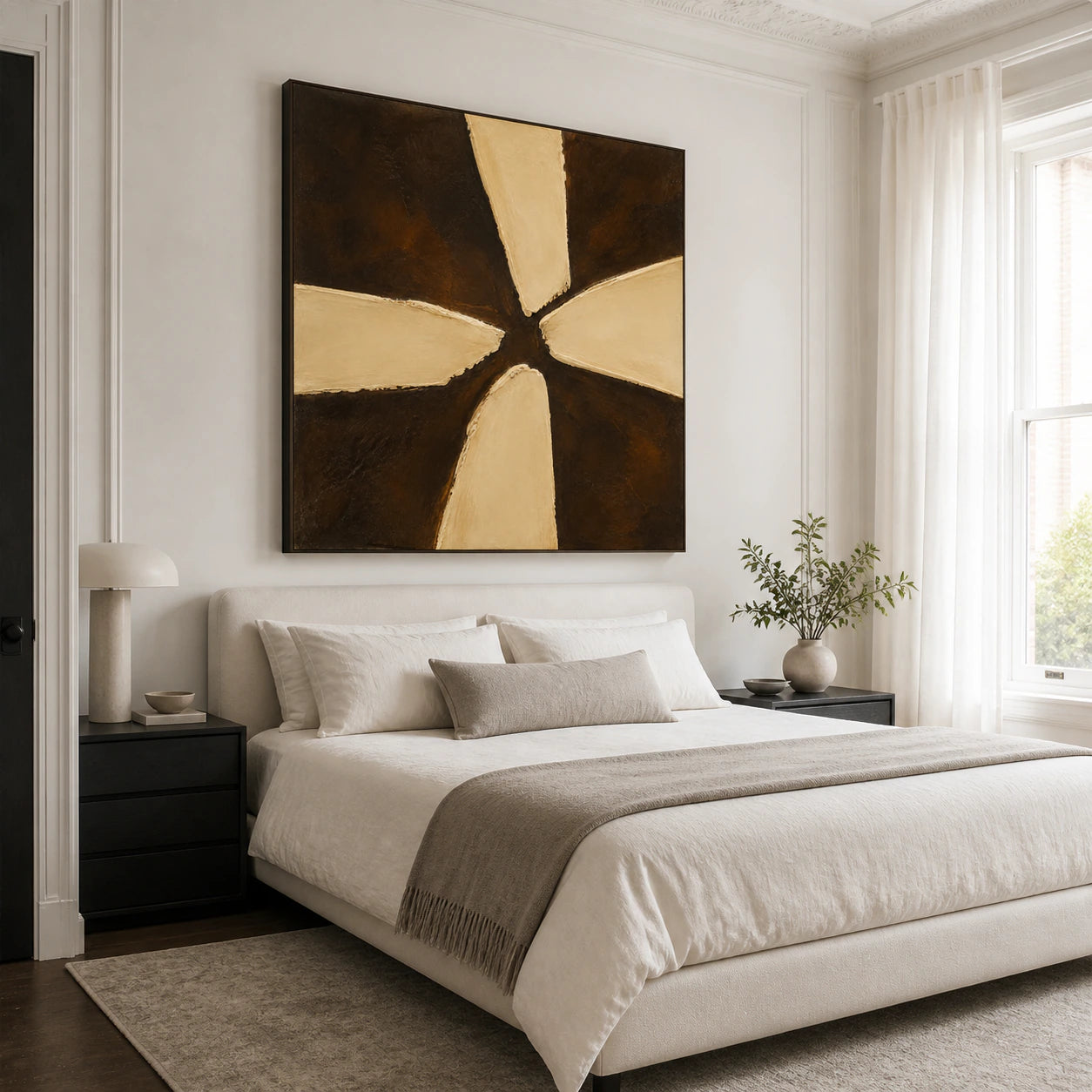 Square dark brown and ochre abstract painting in a calm, softly lit bedroom.