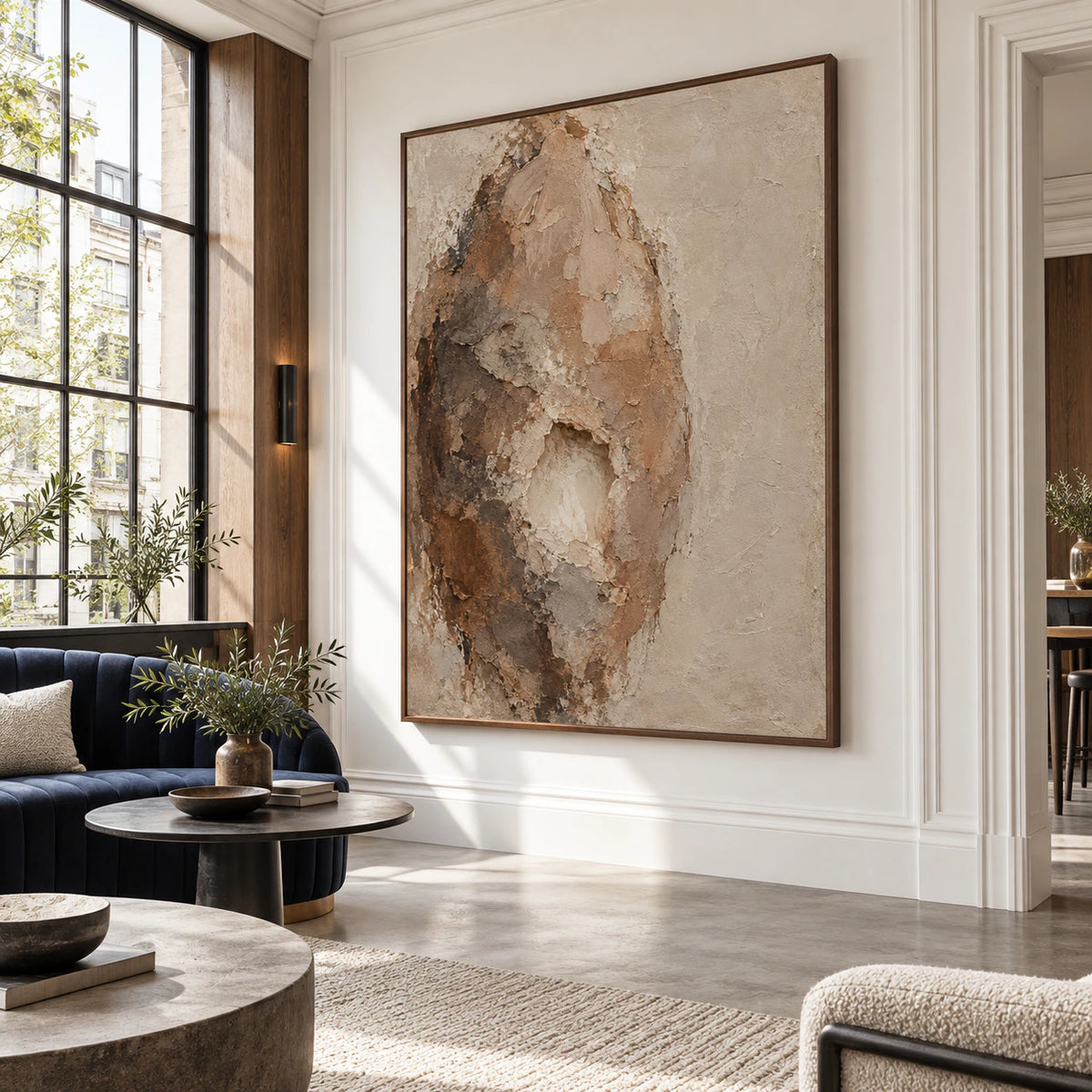 Expansive loft hospitality interior centered on the vertical textured abstract painting.