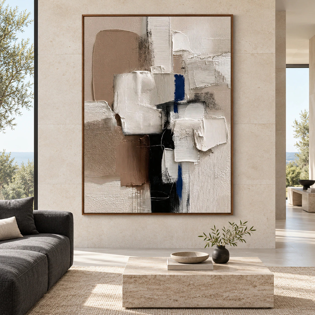 Large vertical textured abstract painting in a bright, expansive architectural living space.