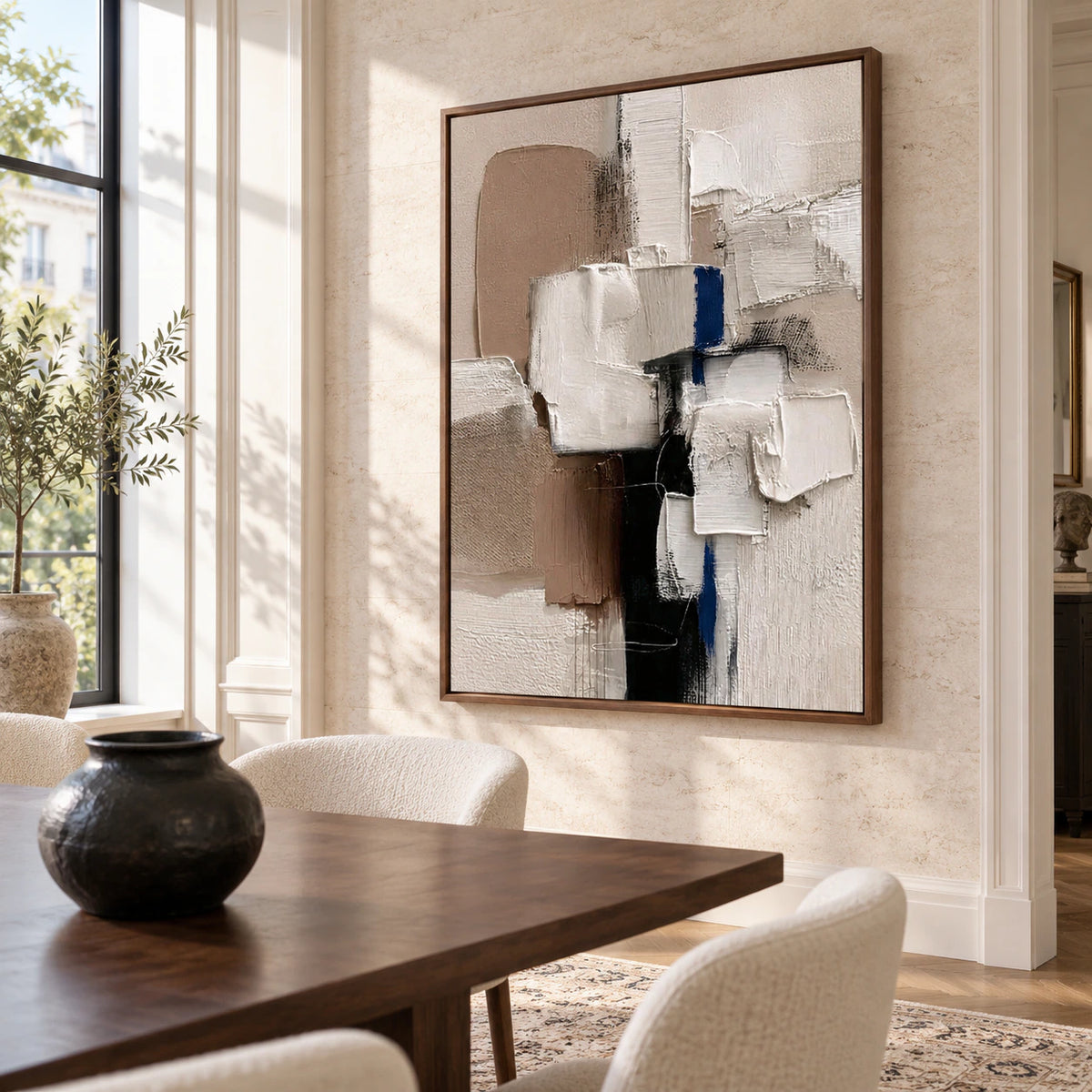 Vertical textured abstract painting in a refined daylight-filled dining room.
