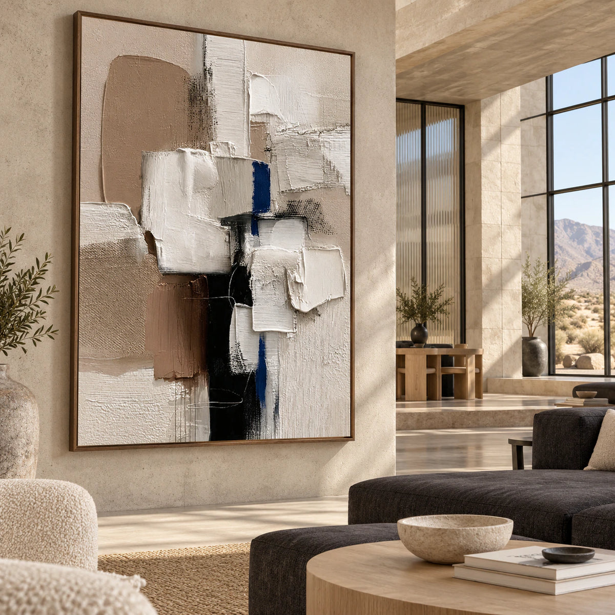 Vertical textured abstract painting in an expansive, sunlit loft hospitality interior.