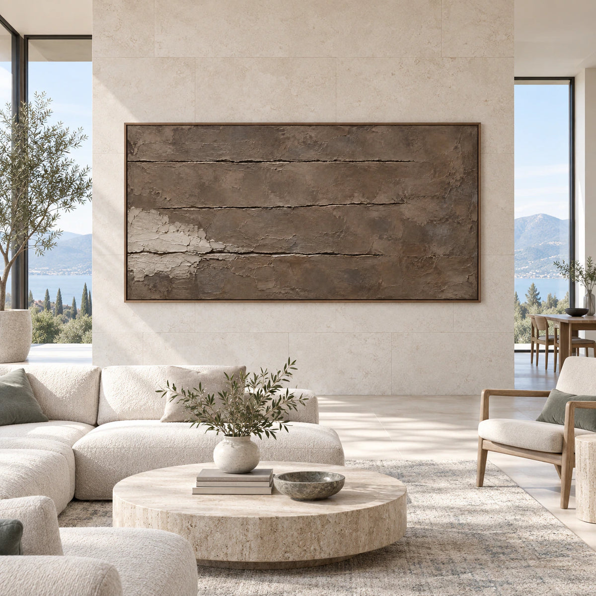 Large earth-toned textured abstract wall art displayed straight-on in a bright, expansive architectural interior.