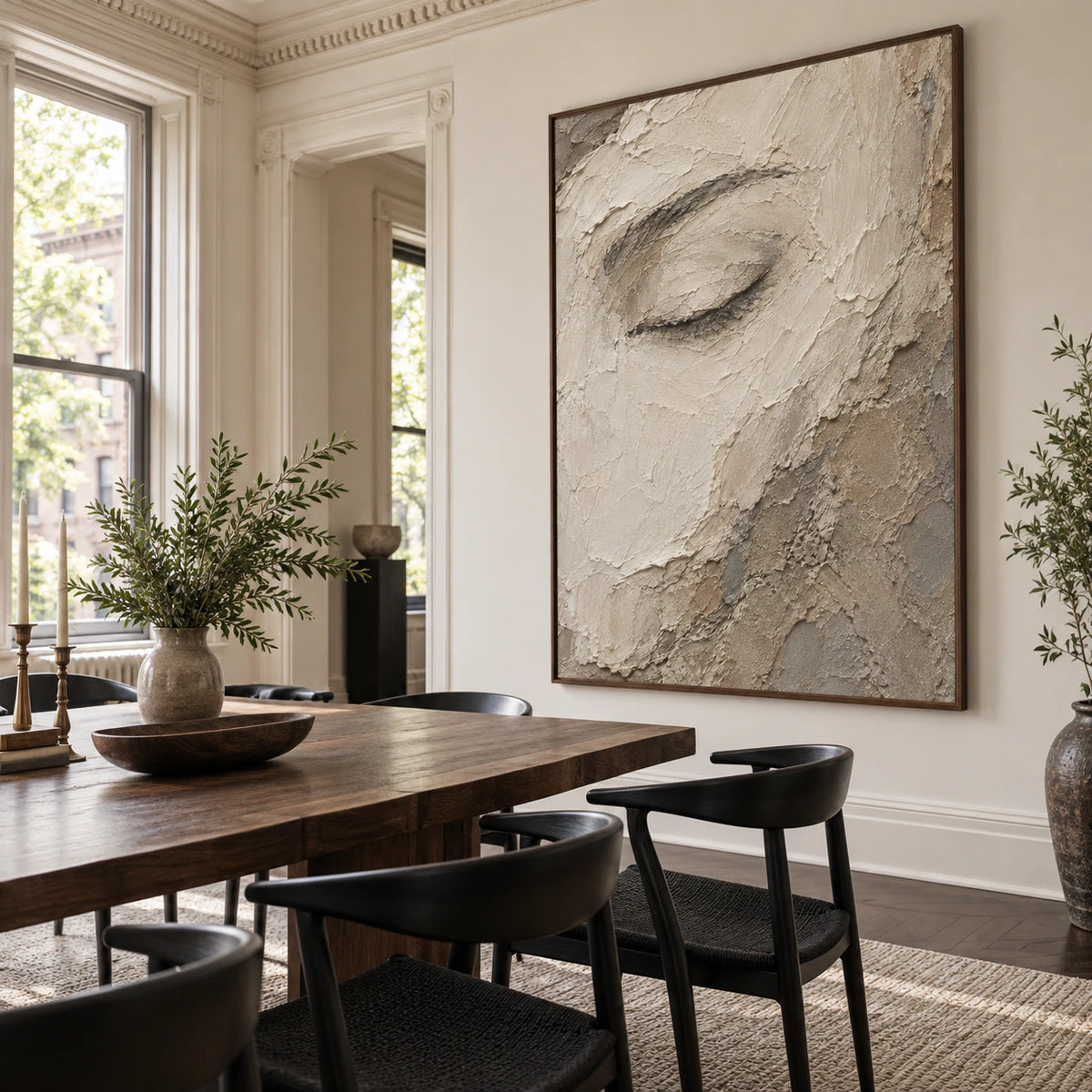 Large Veiled-Gaze painting above a refined dining setting in natural daylight.