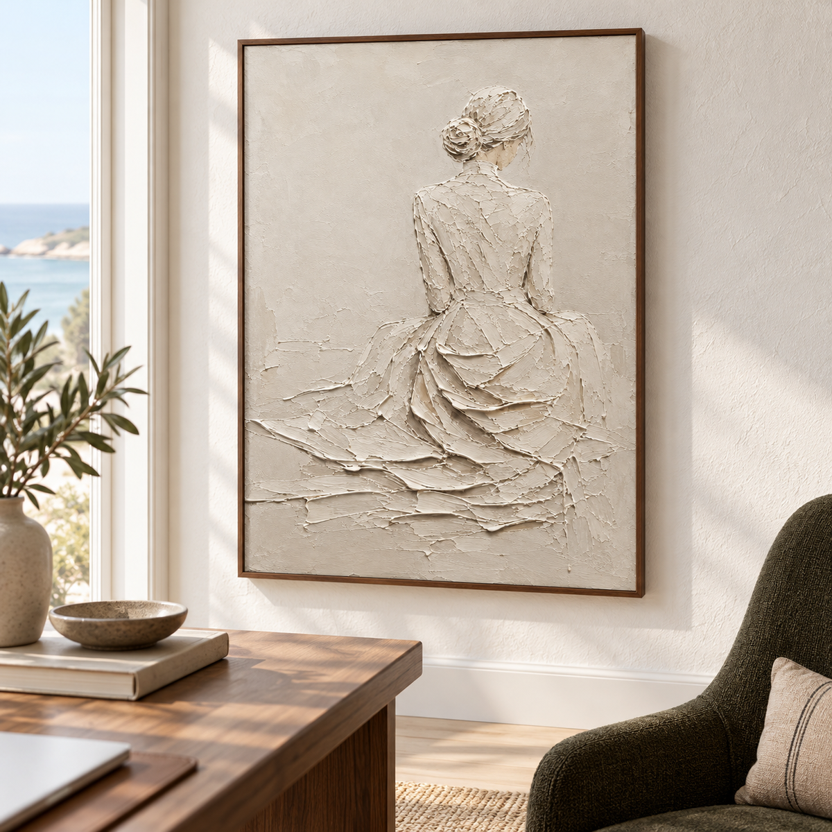 Right oblique view from desk height of a large ivory figure painting above a walnut desk, with a dark upholstered reading chair nearby.