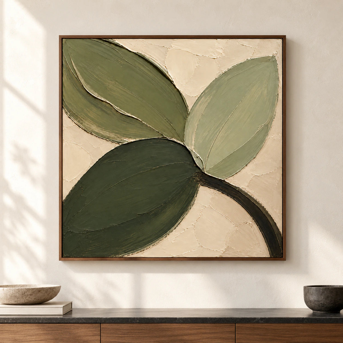Verdant-Fold shown straight-on on a warm pale plaster wall in a bright, open modern room with restrained charcoal, wood and stone furnishings.