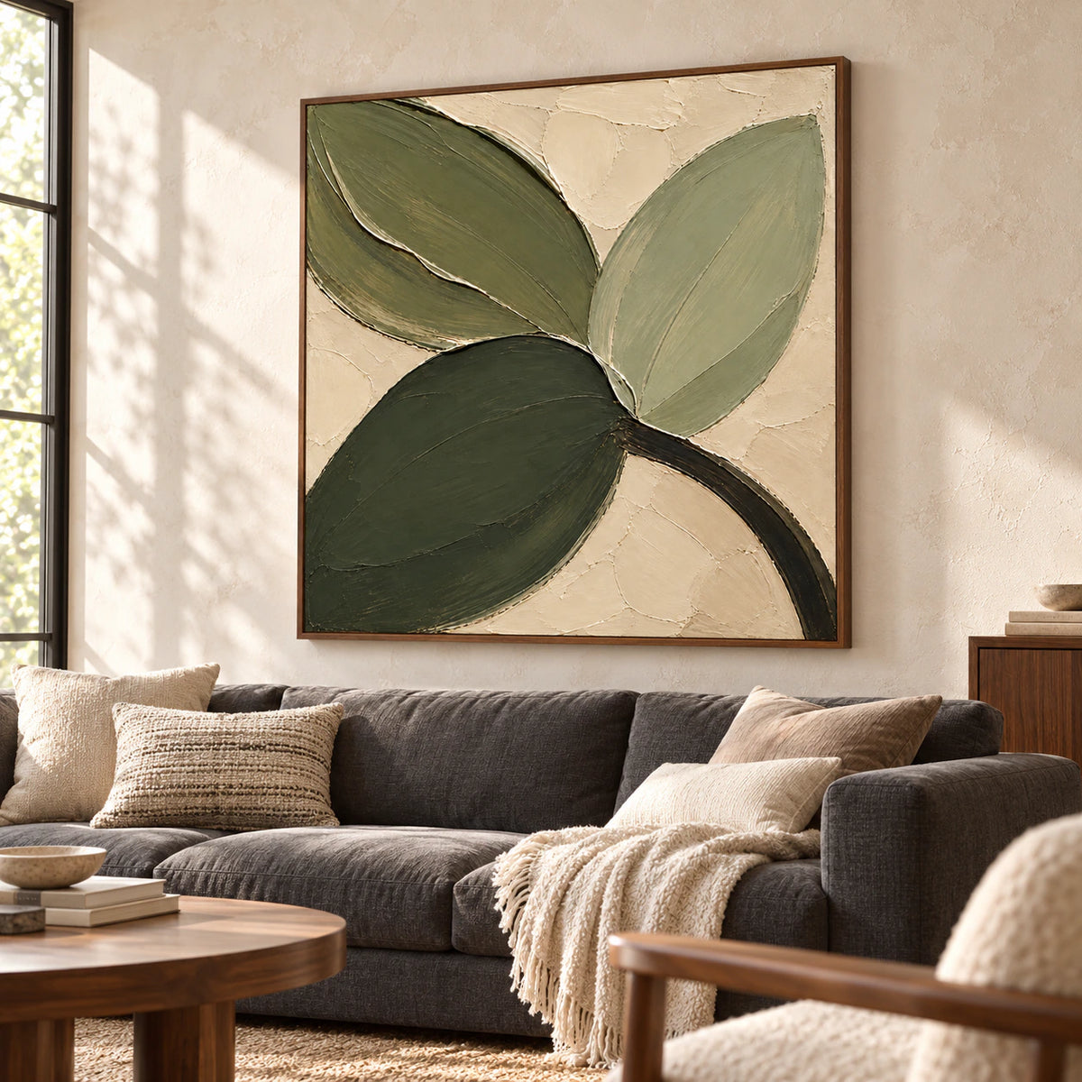Verdant-Fold above a low neutral sofa in a bright living room with pale limewashed walls, natural wood accents and daylight from a side window.