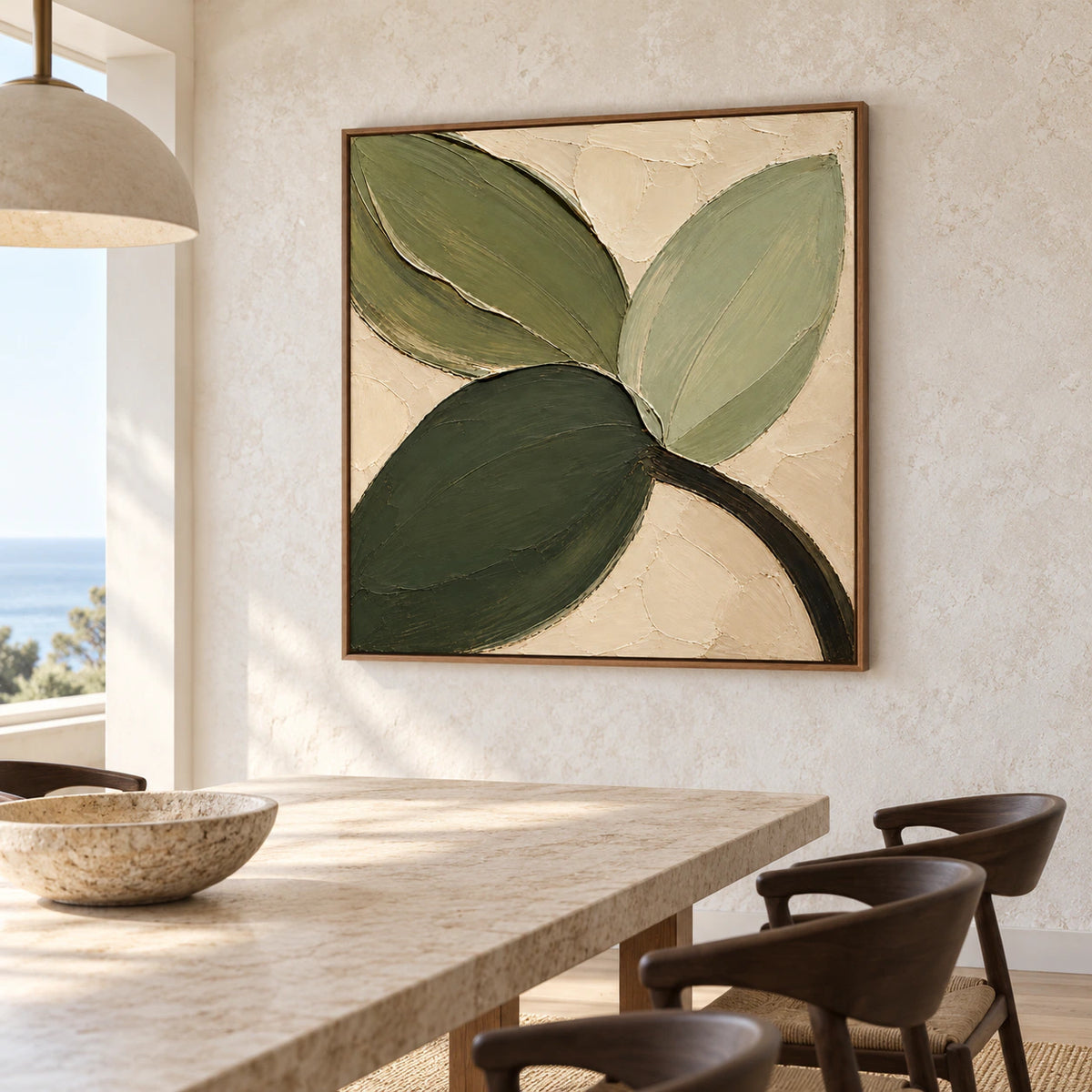 Verdant-Fold on a pale stone dining room wall above a long light-stone table with dark sculptural chairs and a pendant, viewed obliquely from the right.