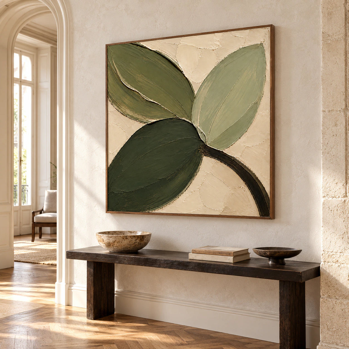 Verdant-Fold on a tall pale stone wall in a high-ceilinged foyer with a narrow dark console and open floor space, viewed from a low left angle.