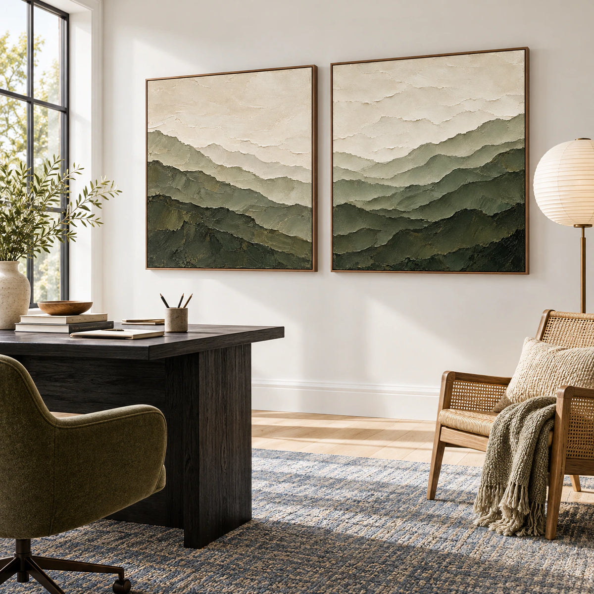 Textured green mountain diptych in an airy reading and home office space.