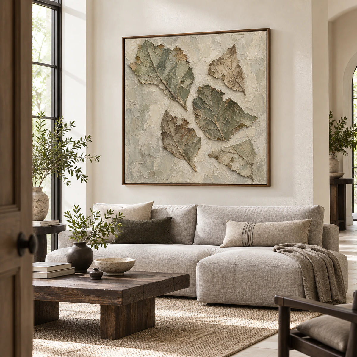 Verdigris-Relief above a restrained sofa in a bright contemporary living room.