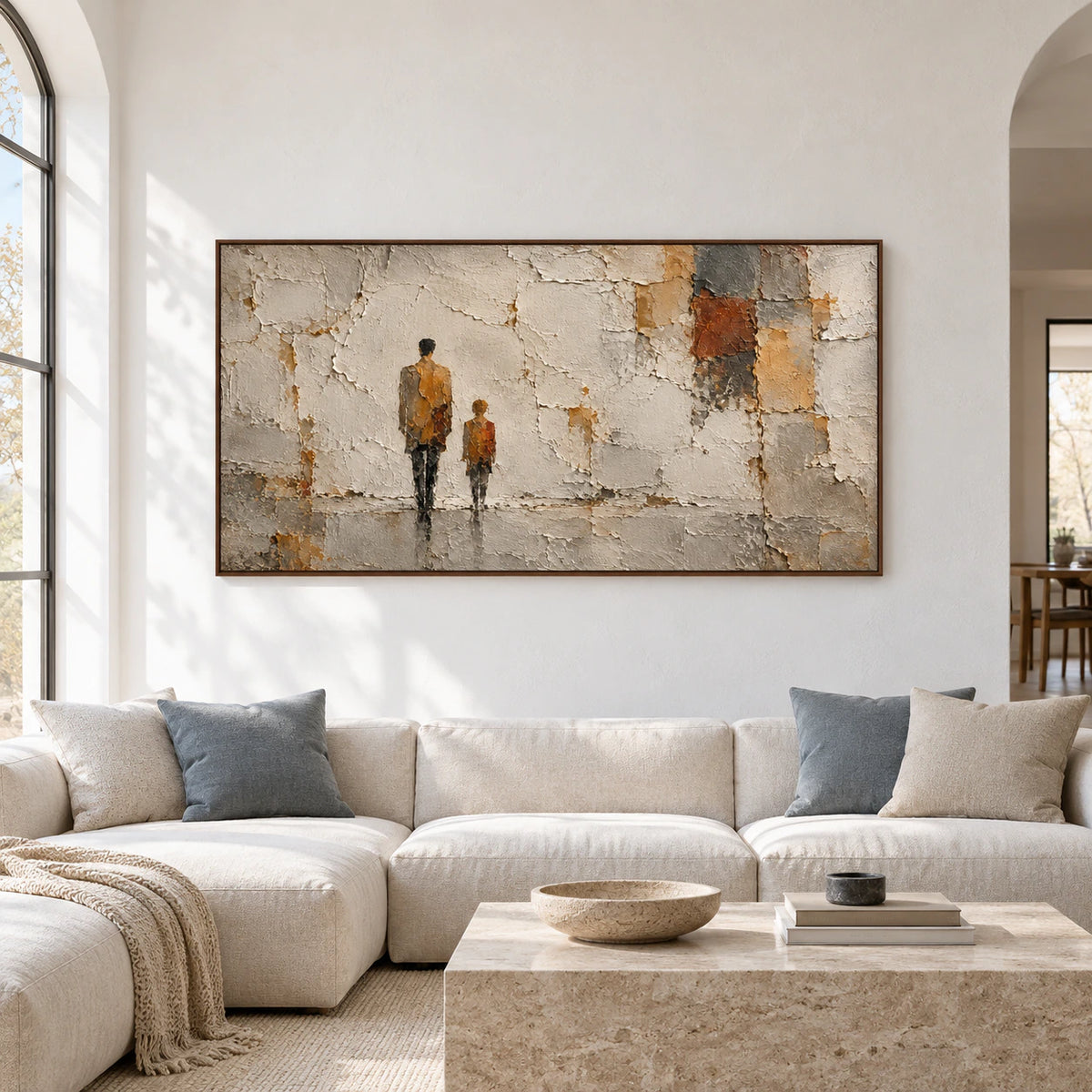 A large horizontal painting of two ochre figures against broken ivory plaster commands the wall in a spacious, bright gallery-like room.