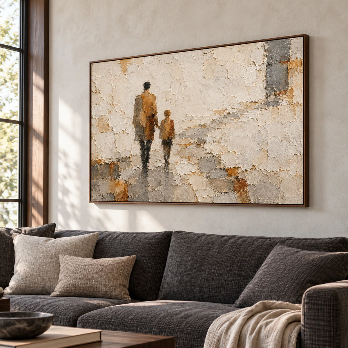 Large horizontal Weathered-Passage painting above a charcoal sofa in a bright, open living room with pale walls and natural daylight.