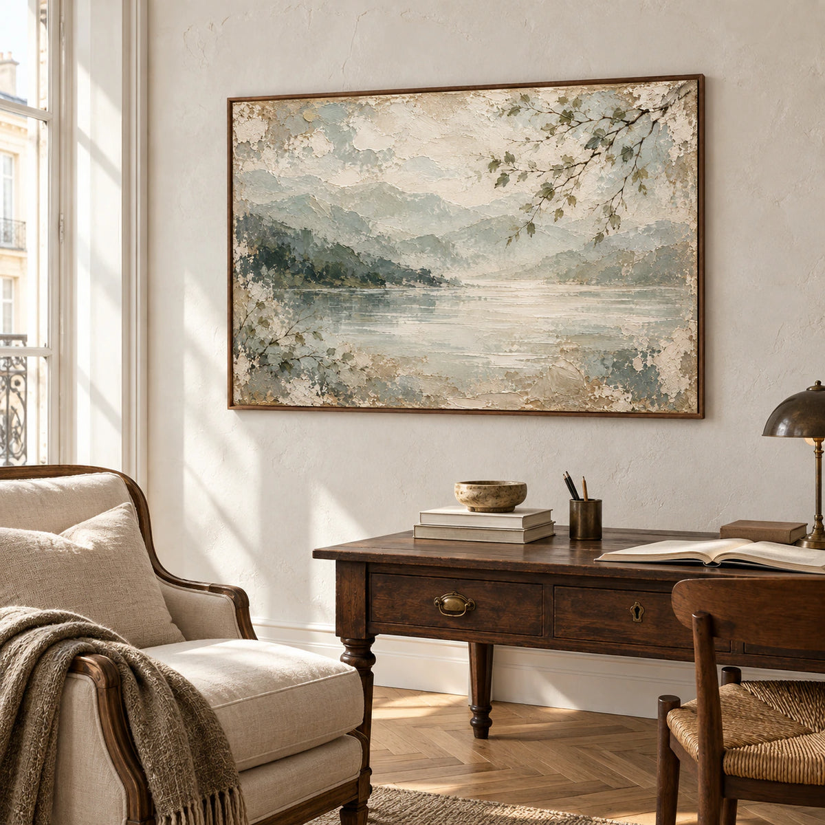 Willow-Inlet artwork in an airy home office beside a reading chair, with pale walls and daylight from a tall window.