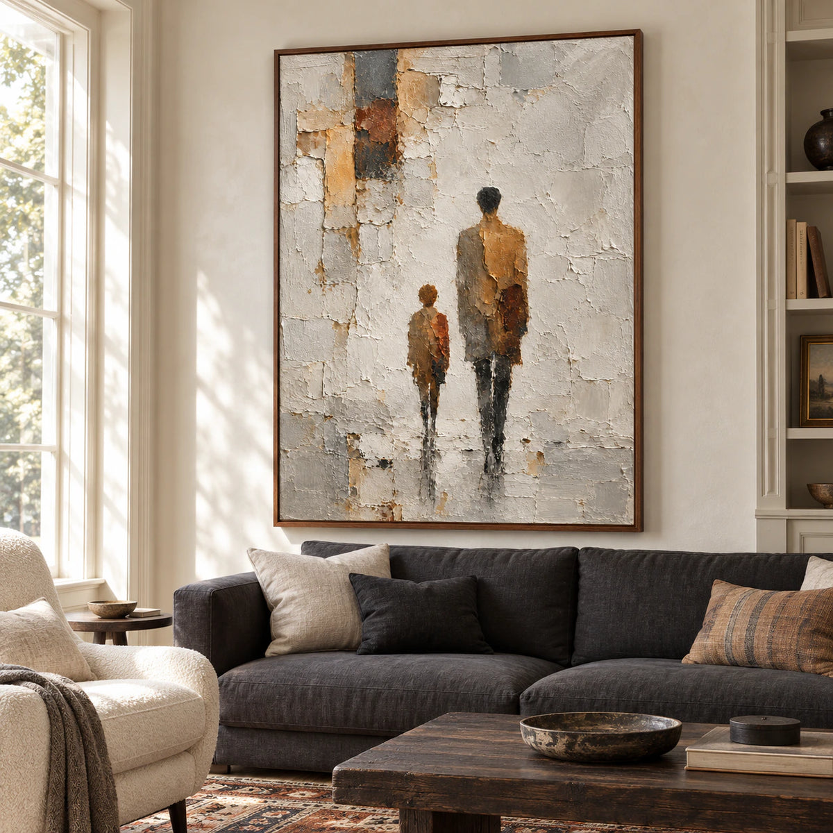 Vertical painting of two figures above a low charcoal sofa in a bright living room with pale plaster walls, viewed slightly from the left at seated height.